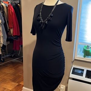 Black dress size small, bodycon elbow sleeves, side ruching.